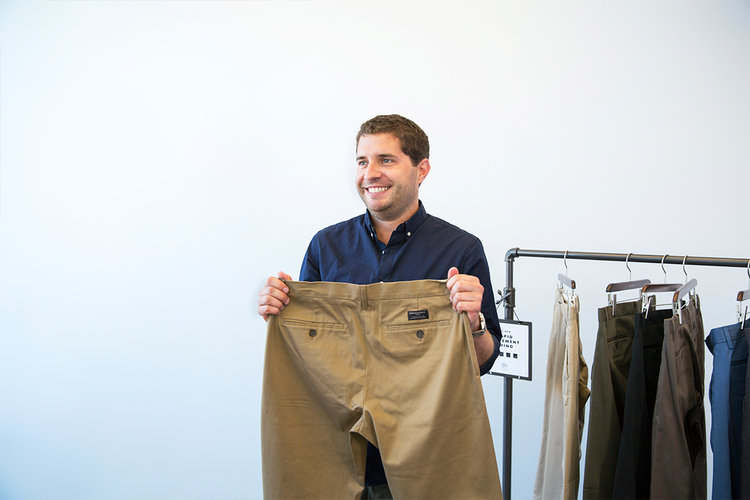 Cody Vidinich, Merchandising Manager for Banana Republic, holds up a pair of the newly released Rapid Movement Chinos.